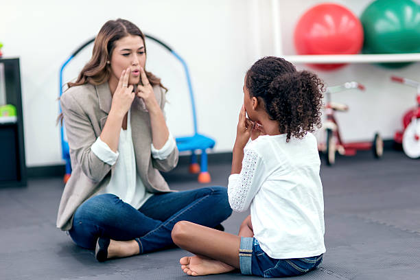 Speech therapist working with a child