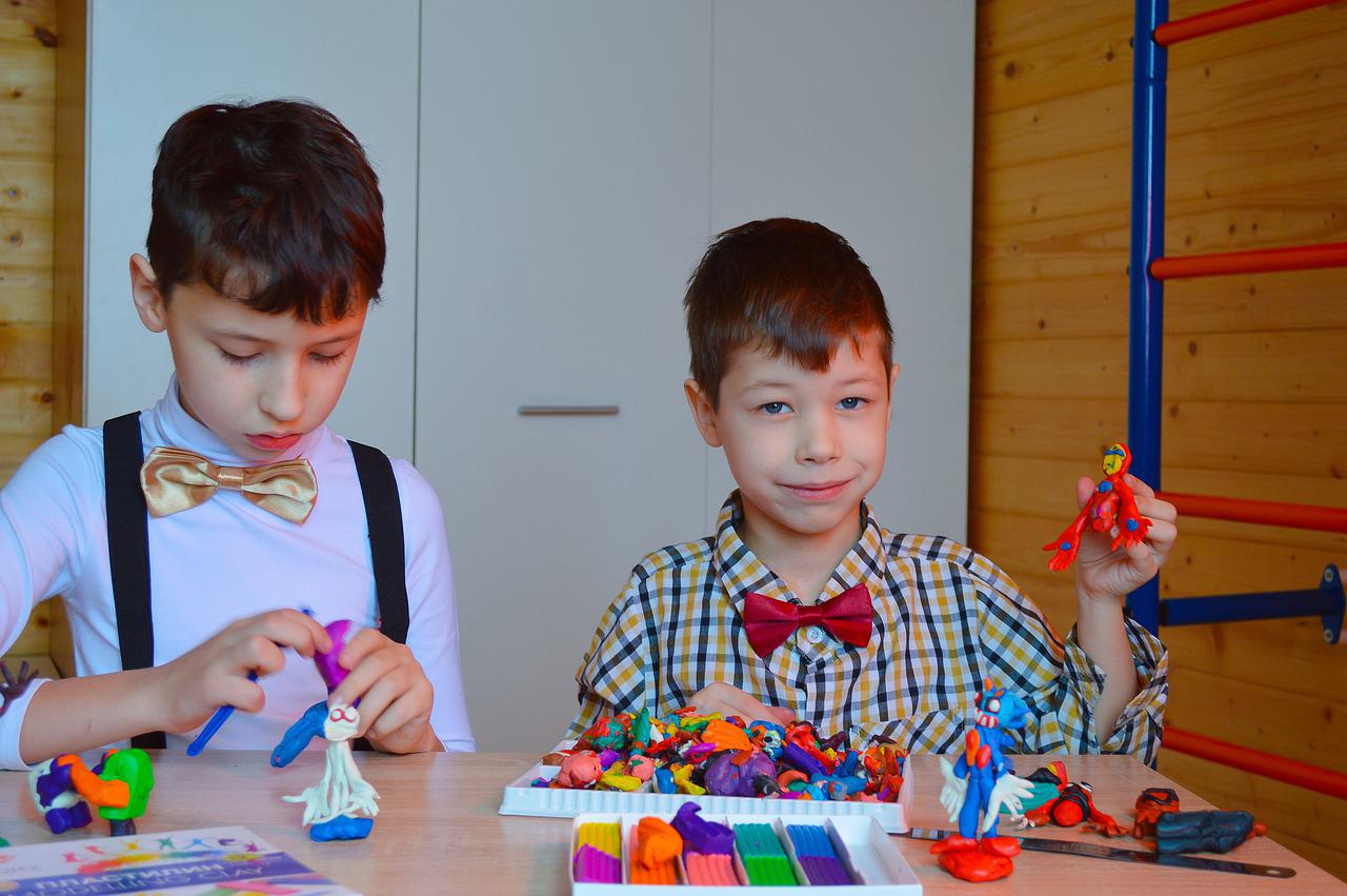 two boys making craft